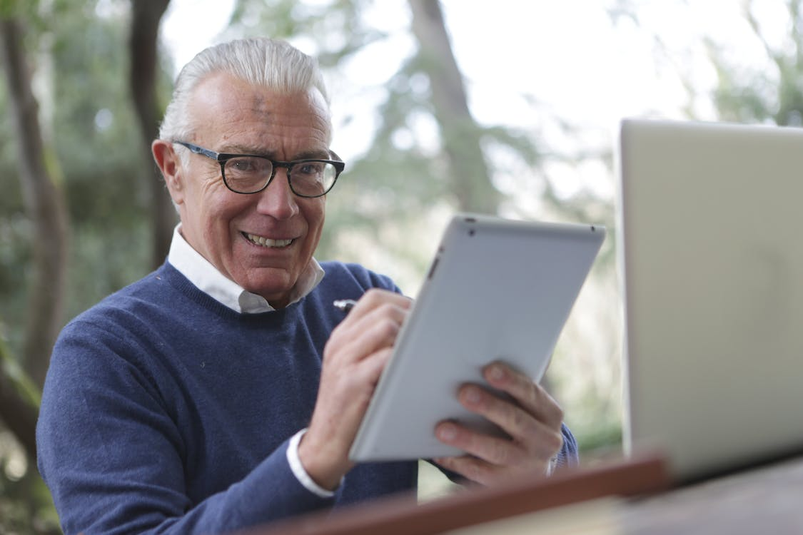 a senior using an iPad.