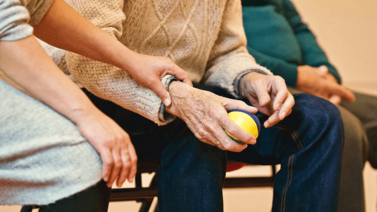 a person holding a hand of a senior