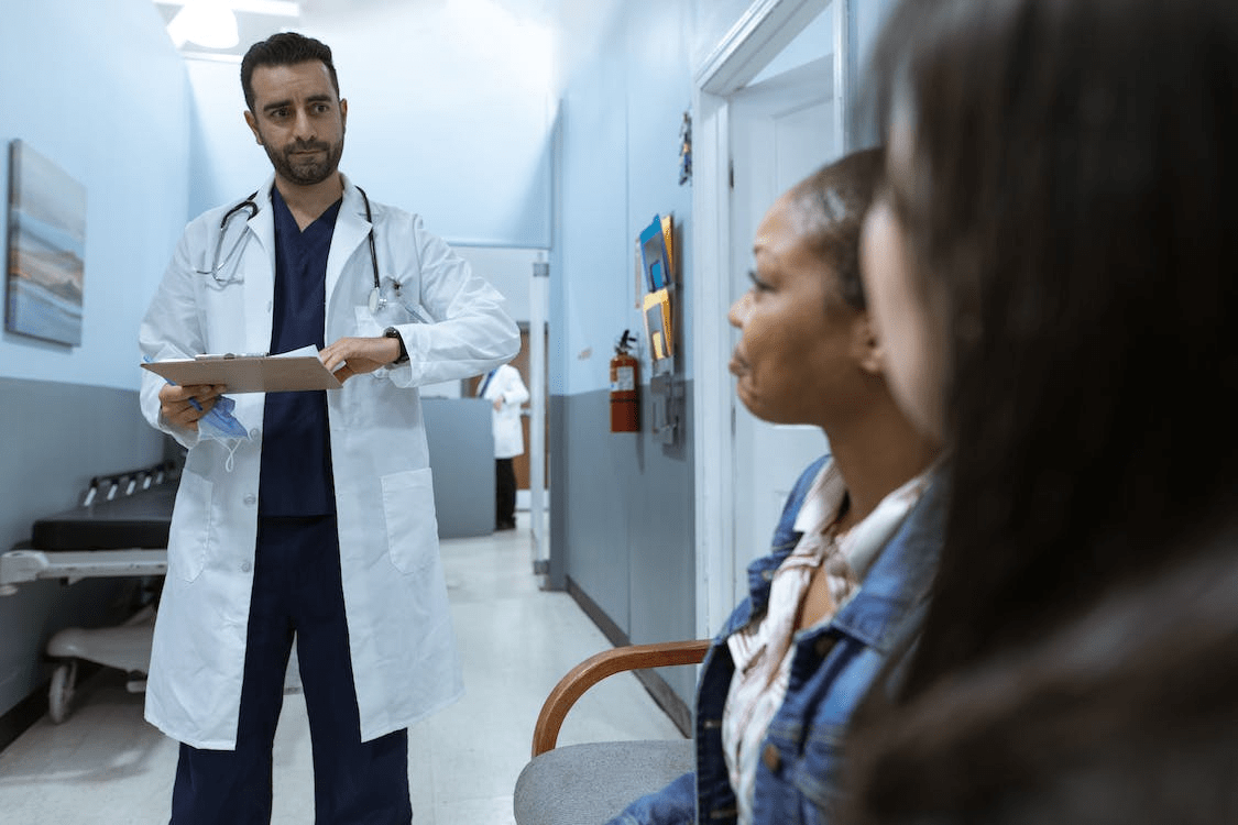 doctor speaking to a patient.