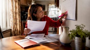 Woman coordinating Medicare and Social Security documents