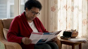 Woman reviewing Medicare vision coverage materials
