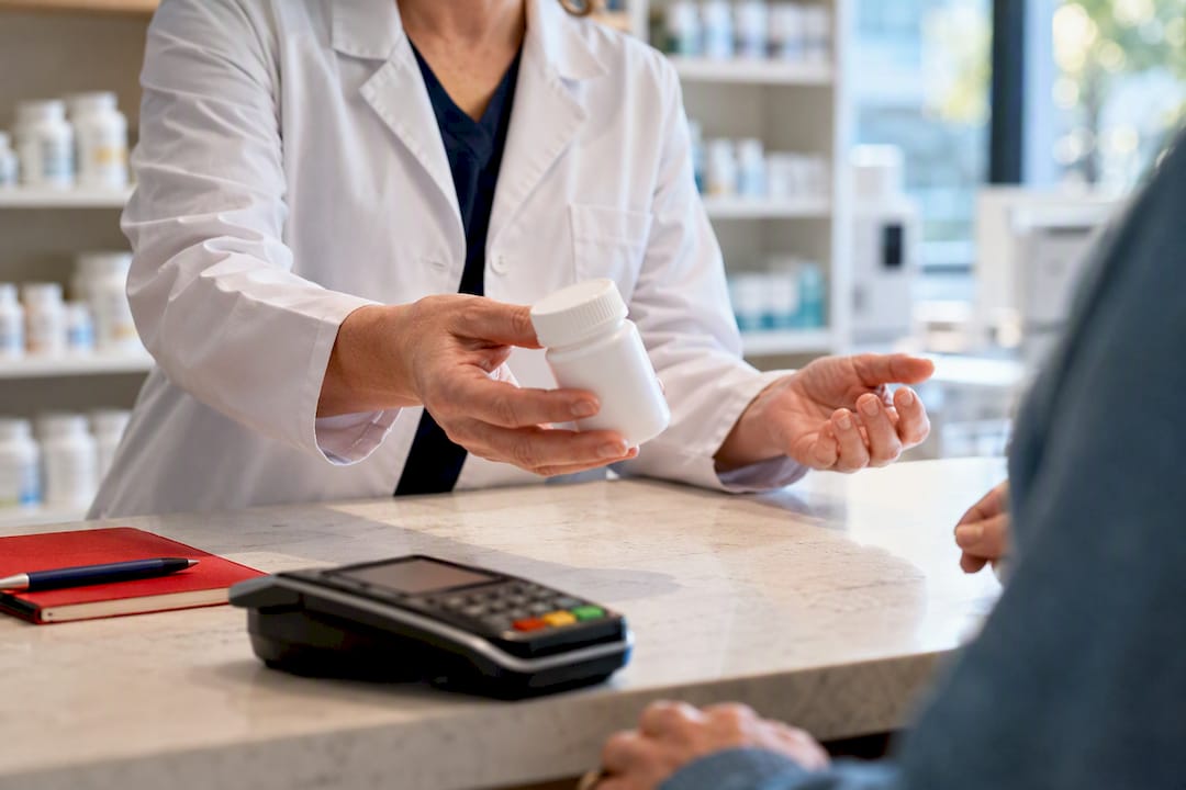 Pharmacist completing approved prescription pickup