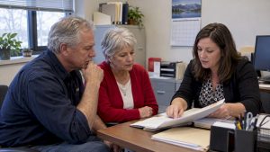 Older worker reviewing Medicare delay paperwork
