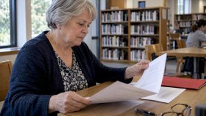Senior comparing long-term care policy costs