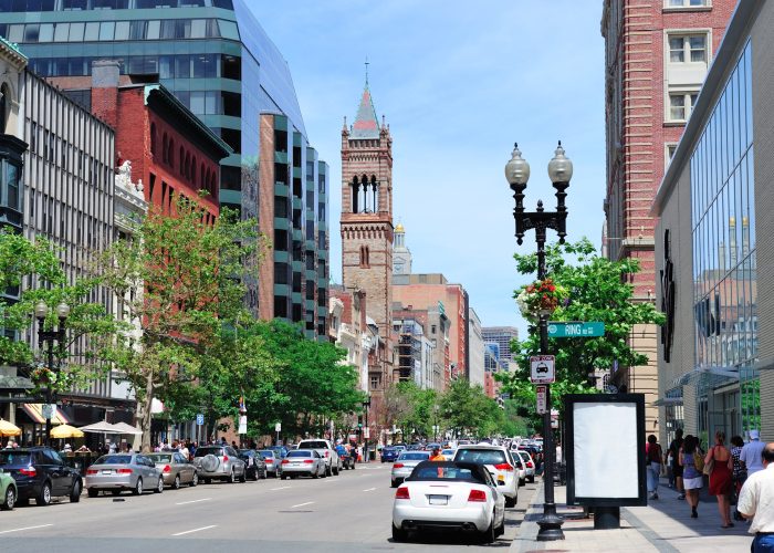 Boston city street view with traffic and historical architecture.