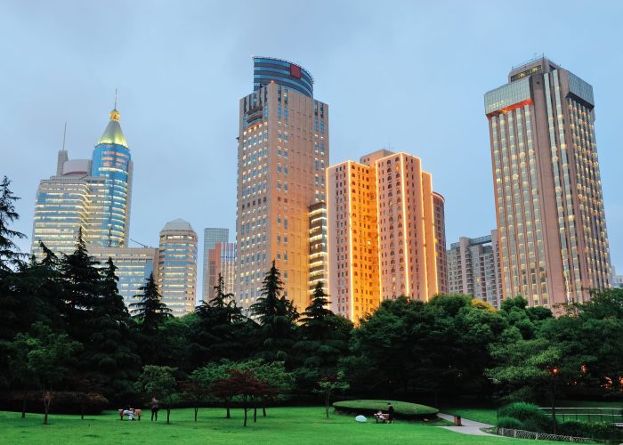 Shanghai urban architecture at dusk in park.